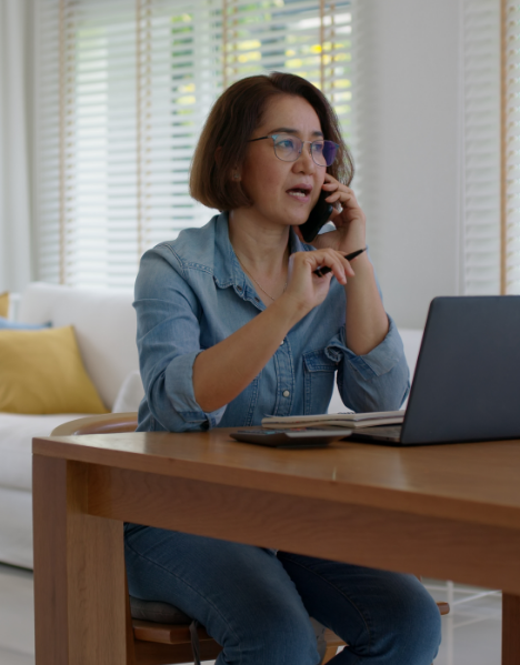 Woman talking on phone working.